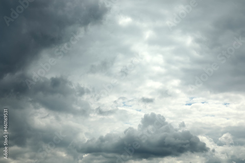 Sky with heavy rainy clouds on grey day photo