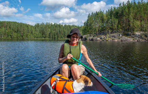 Woman canoeing on lake in Finland