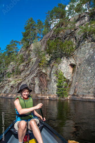 Woman canoeing on lake in Finland