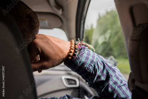 USA, Alaska, Close-up of mans hand in car photo