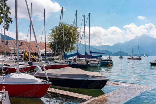 Austria, Boats moored at pier on Mondsee photo