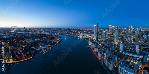 UK, London, Aerial view of Canary Wharf and Thames river at night