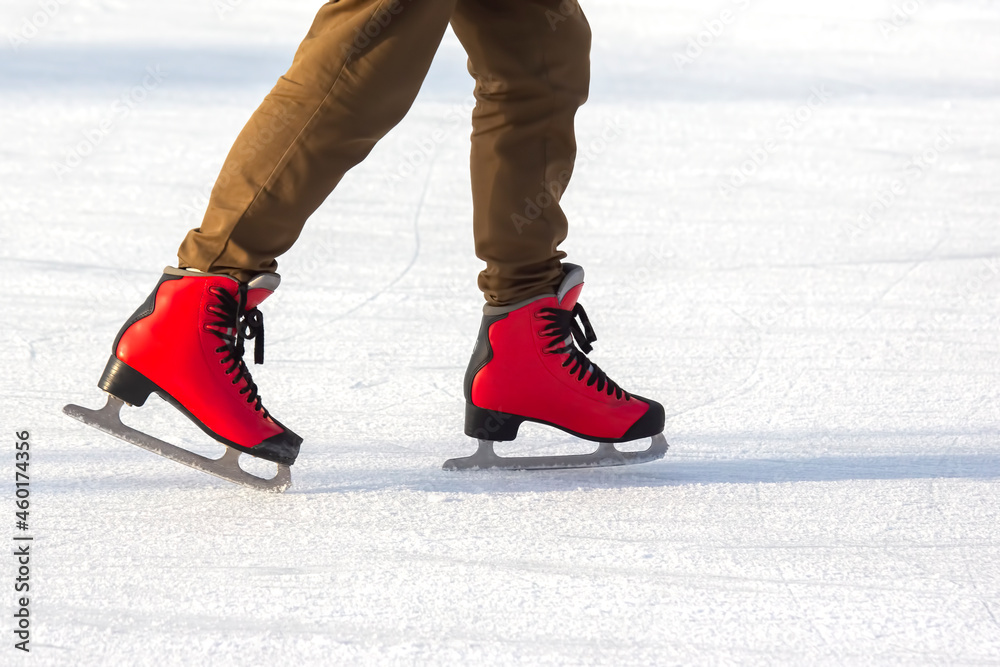 people ice skating on an ice rink. hobbies and leisure. winter sports people ice skating on an ice rink. hobbies and leisure. winter sports