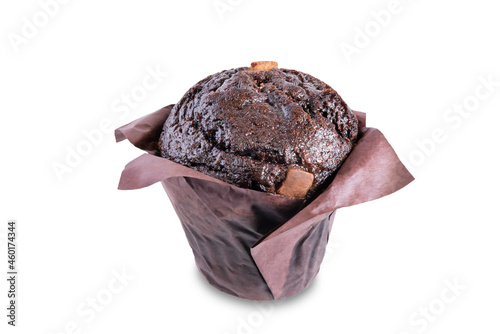 Sweet fresh chocolate muffin with chocolate slices on a white isolated background