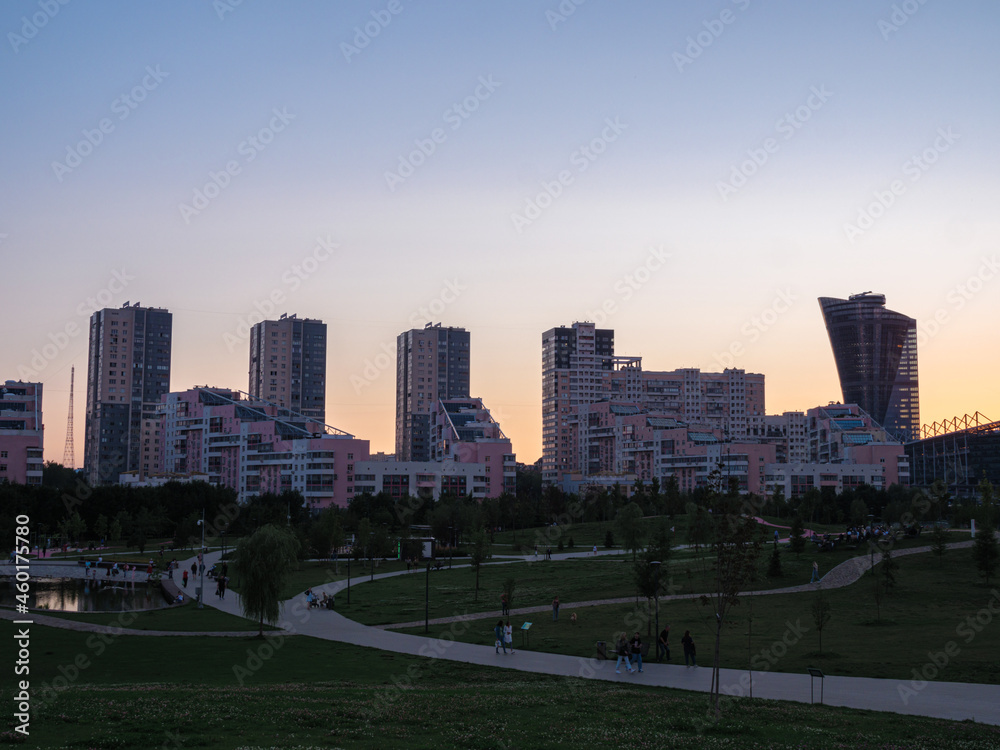 Park and residential skyscrapers at Khodynskoe field at sunset