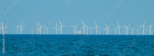 View of the windmills by the sea in a village in Wales