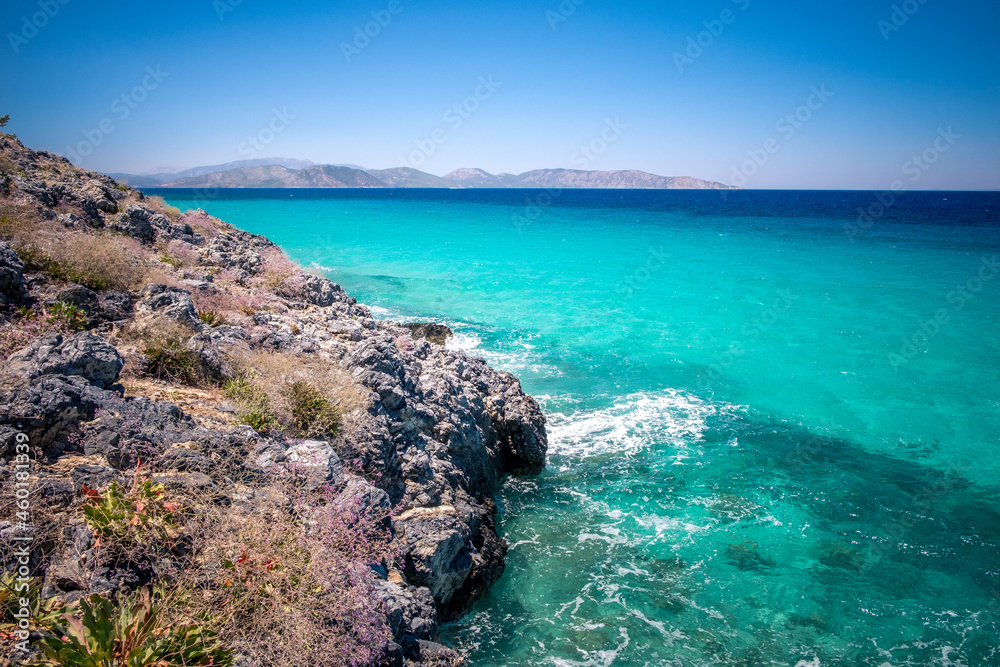 Fototapeta premium Blue sea on the Turkish coast. Azure water and beautiful rocks. Dilek National Park, Kusadasi, Turkey