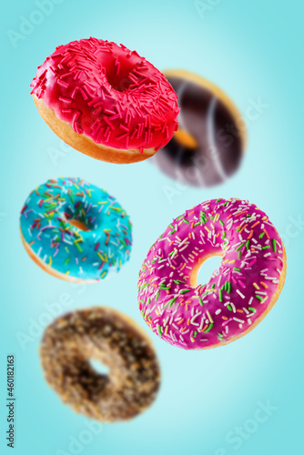 Sweet multicolor donuts on a blue background