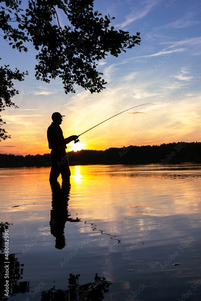 fisherman silhouette during sunset