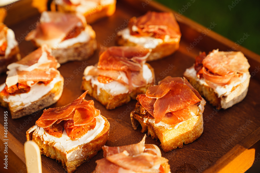 canapes with sauce and meat for the buffet. catering for a dinner party. canapes with sauce and meat for the buffet. catering for a dinner party.