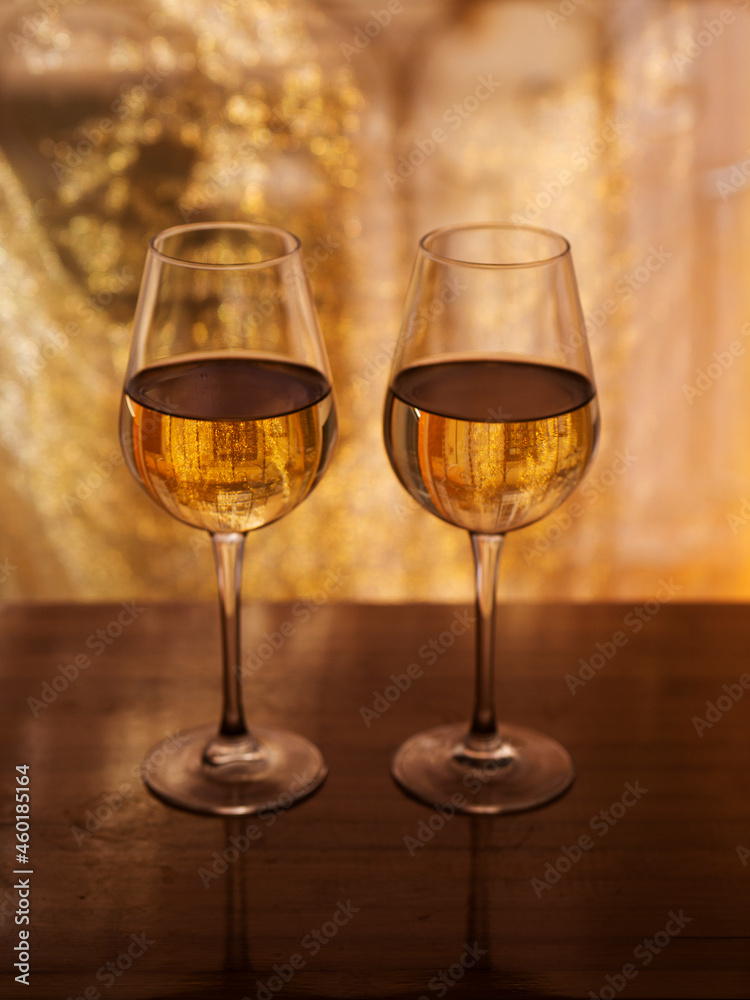 two wine glasses with white wine