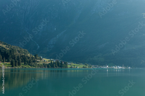 A tranquil landscape of a lake with the mountains on the background, Norway