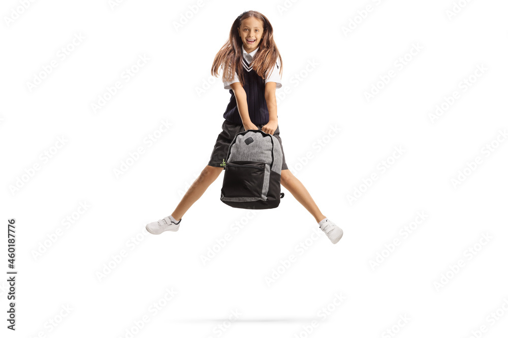 Happy schoolgirl with long hair jumping and holding a backpack Happy schoolgirl with long hair jumping and holding a backpack