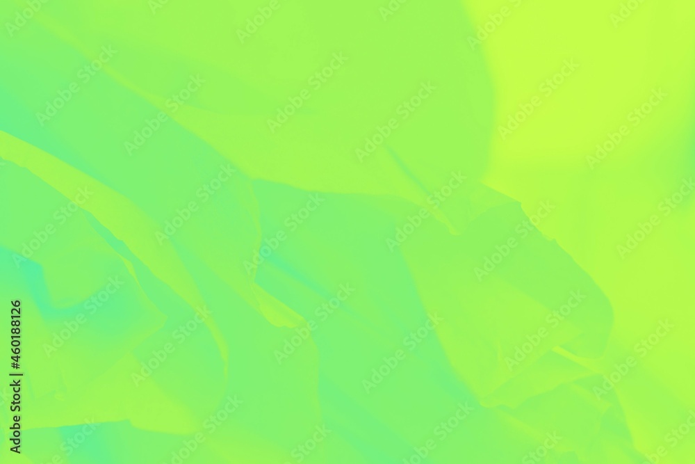 Green yellow shine neon color flying fabric texture, abstract blurred background