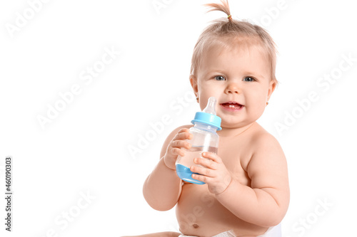 Cute baby girl with bottle of water on white background © Pixel-Shot