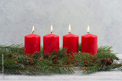 Red candles on a advent wreath  christmas decoration with candlelight