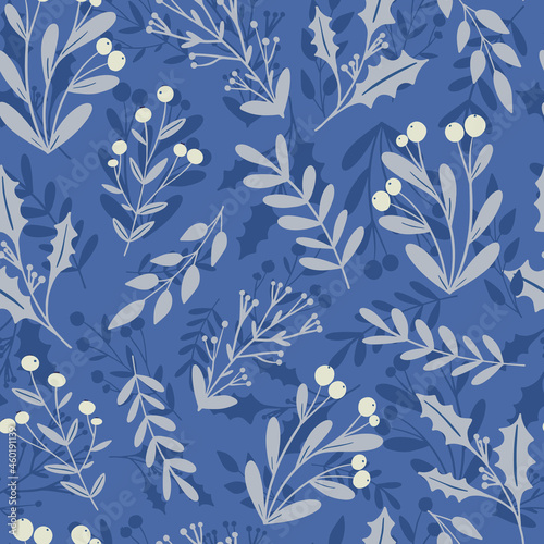 Beautiful winter season floral seamless pattern background. Frozen holly berry, mistletoe plant silhouette on blue background. Festive vector backdrop, seasonal textile design