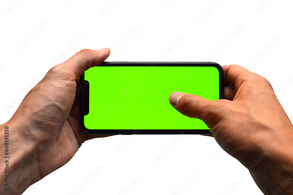 Photo of two hands holding a mobile device - iPhone template with green screen to add a customized image or text with chroma key - Smartphone blank screen to show an app, game or website on display