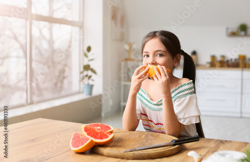 Little girl eating fresh gr...