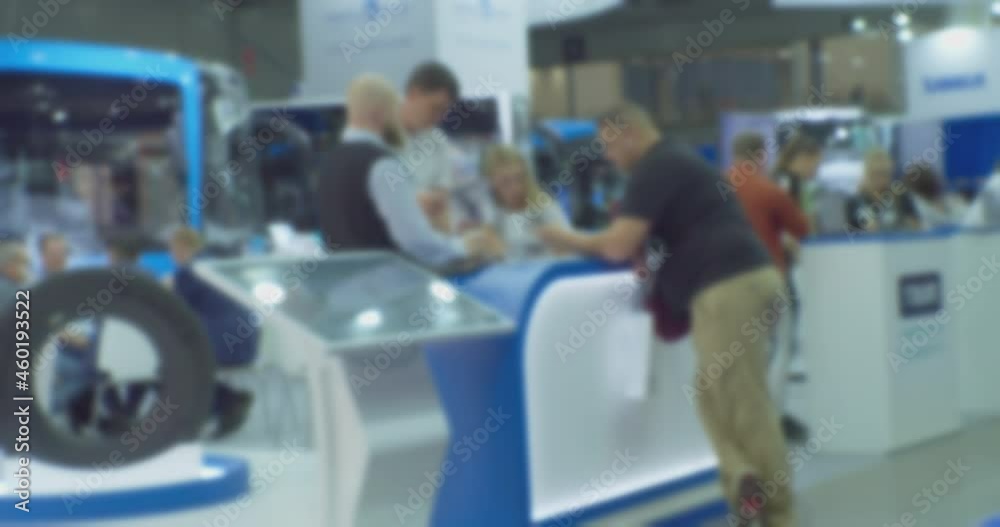 Abstract blurred background on business theme. Blurry defocused video. Unrecognizable people in a large modern building.