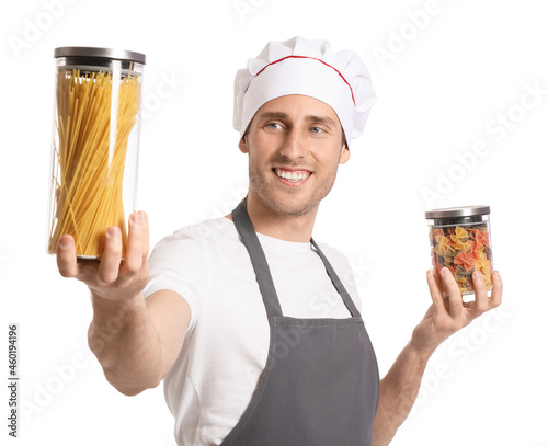 Handsome chef holding jars ...