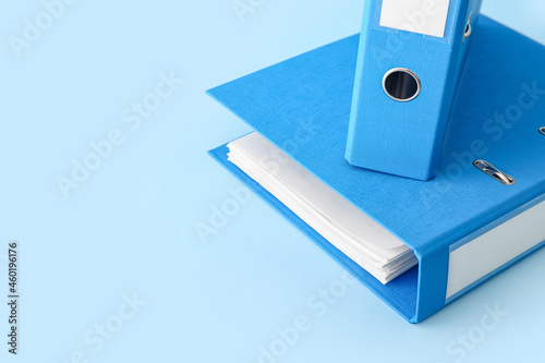 Office folders on color background