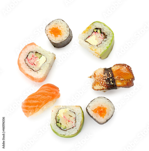 Frame made of different sushi and rolls on white background