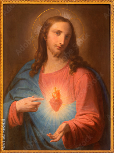 ROME, ITALY - SEPTEMBER 2, 2021: The tradicional catholic painting of Heart of Jesus in the church Chiesa dei Santi Marcellino e Pietro al Laterano by unknown artist. photo