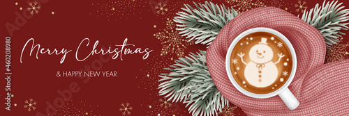 Coffee cup with warm knitted scarf and christmas tree branches. Background for greeting card, invitation or advertise