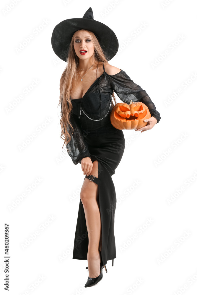 Sexy young witch with Halloween pumpkin on white background Sexy young witch with Halloween pumpkin on white background