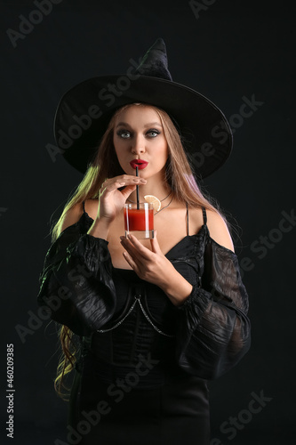 Sexy young witch with cockt...