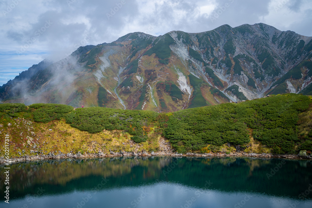 富山県立山町の立山にあるみくりが池周辺の秋の紅葉の季節の風景 Scenery of autumn leaves around Mikurigaike Pond in Tateyama, Tateyama Town, Toyama Prefecture, Japan. 富山県立山町の立山にあるみくりが池周辺の秋の紅葉の季節の風景 Scenery of autumn leaves around Mikurigaike Pond in Tateyama, Tateyama Town, Toyama Prefecture, Japan.