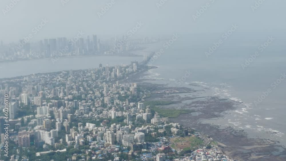 View From Airplane Of Mahim Bay, Arabian Sea, And Coastal Skyline Of Mumbai In Fog. aerial View From Airplane Of Mahim Bay, Arabian Sea, And Coastal Skyline Of Mumbai In Fog. aerial