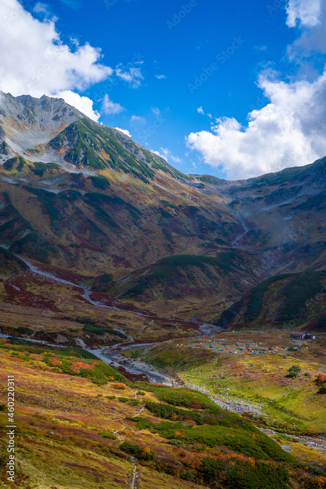 富山県立山町の立山の秋の紅葉の季節に登山している風景 Scenery of climbing Tateyama Mountain in Tateyama Town, Toyama Prefecture, Japan during the season of autumn leaves. 富山県立山町の立山の秋の紅葉の季節に登山している風景 Scenery of climbing Tateyama Mountain in Tateyama Town, Toyama Prefecture, Japan during the season of autumn leaves.