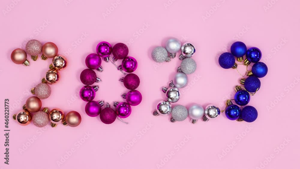Christmas ornaments making 2022 year and blinking lights around. Stop motion Christmas ornaments making 2022 year and blinking lights around. Stop motion