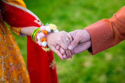 Indian couple s holding hands close up