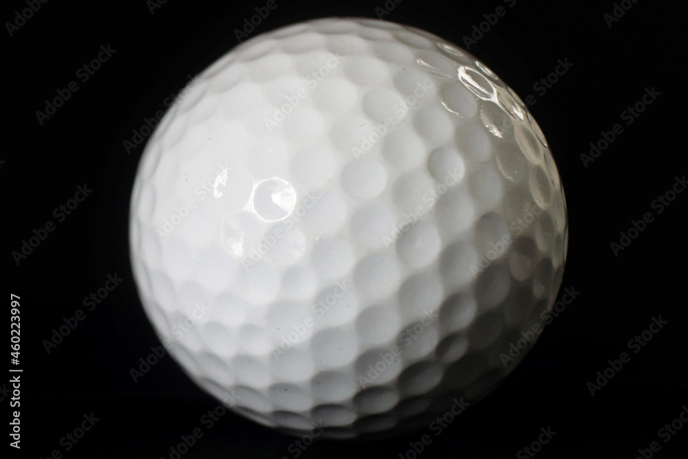 golf ball on the black background golf ball on the black background