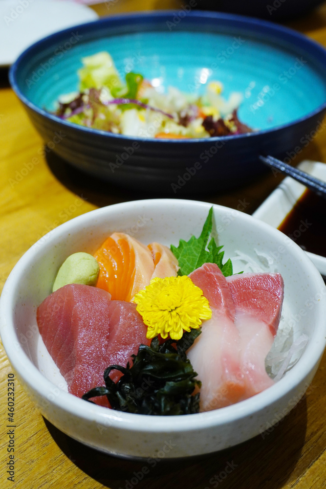 Sashimi is a Japanese delicacy consisting of fresh raw fish or meat sliced into thin pieces and often eaten with soy sauce. Sashimi is a Japanese delicacy consisting of fresh raw fish or meat sliced into thin pieces and often eaten with soy sauce.
