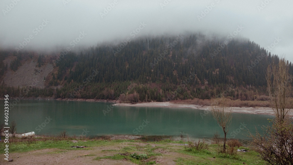 Misty lake in the mountains of Kazakhstan