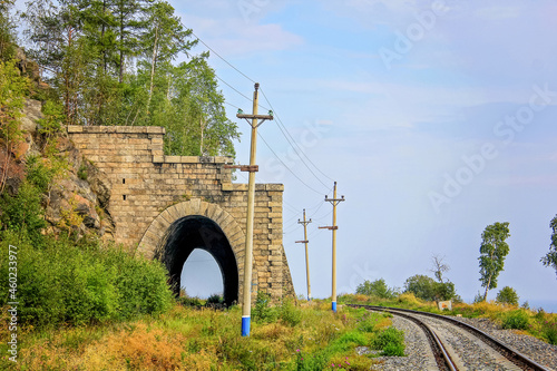 Around Lake Baikal railway near Slyudyanka. Siberian railway track with retaining wall, viaduct, tunnel photo