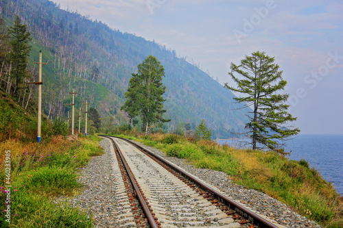 Around Lake Baikal railway near Slyudyanka. Siberian railway track with retaining wall, viaduct, tunnel