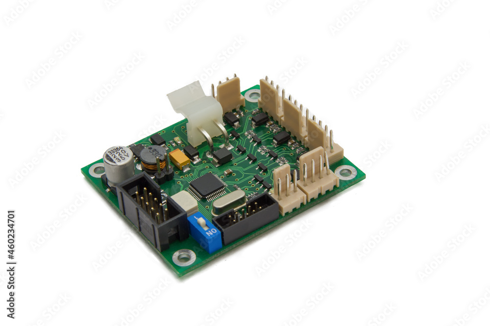 Isolated image of a green printed circuit board assembly. PCB production industry for microelectronics Isolated image of a green printed circuit board assembly. PCB production industry for microelectronics
