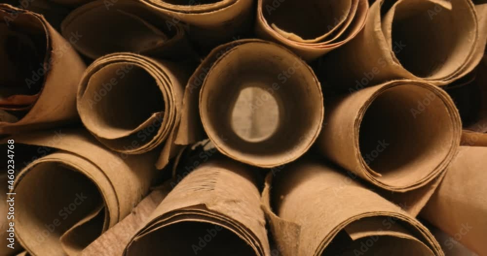 Scrolls with futhpak symbols stacked on pile. Ancient scribe library. Scrolls with futhpak symbols stacked on pile. Ancient scribe library.