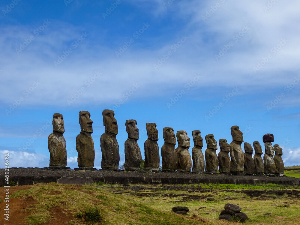 Moai statues with colorful clouds on Easter Island. Ahu Tongariki against Blue Sky, Chile, South America