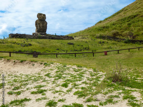 Anakena beach on Easter Island. Sandy beach strip with coconut trees, moai statues and views of the Pacific Ocean, Chile, South America photo