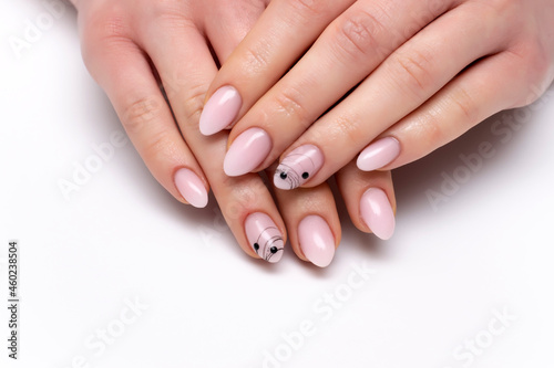 Ombre nail design with black spider web and stones on short sharp  oval nails close-up on a white background