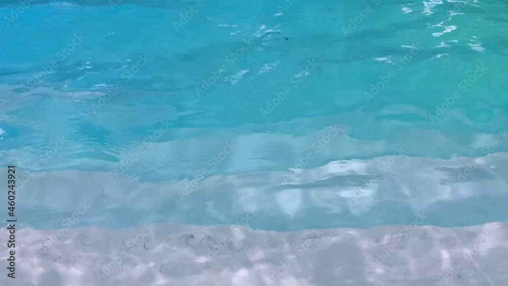Turquose water waves and underwater steps in the swimming pool - stock video. Turquose water waves and underwater steps in the swimming pool - stock video.
