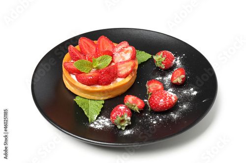 Plate with strawberry tart isolated on white background