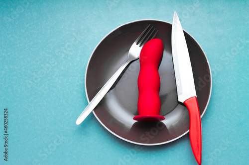 Quadro em tela there is a dildo on the plate, and a knife and fork next to it; a grotesque on t