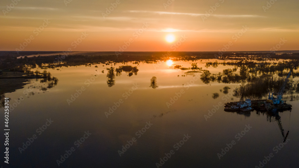 Aerial atmospheric view on big river. Aerial drone view of river landscape in sunny sunset. Nature concept. Aerial atmospheric view on big river. Aerial drone view of river landscape in sunny sunset. Nature concept.